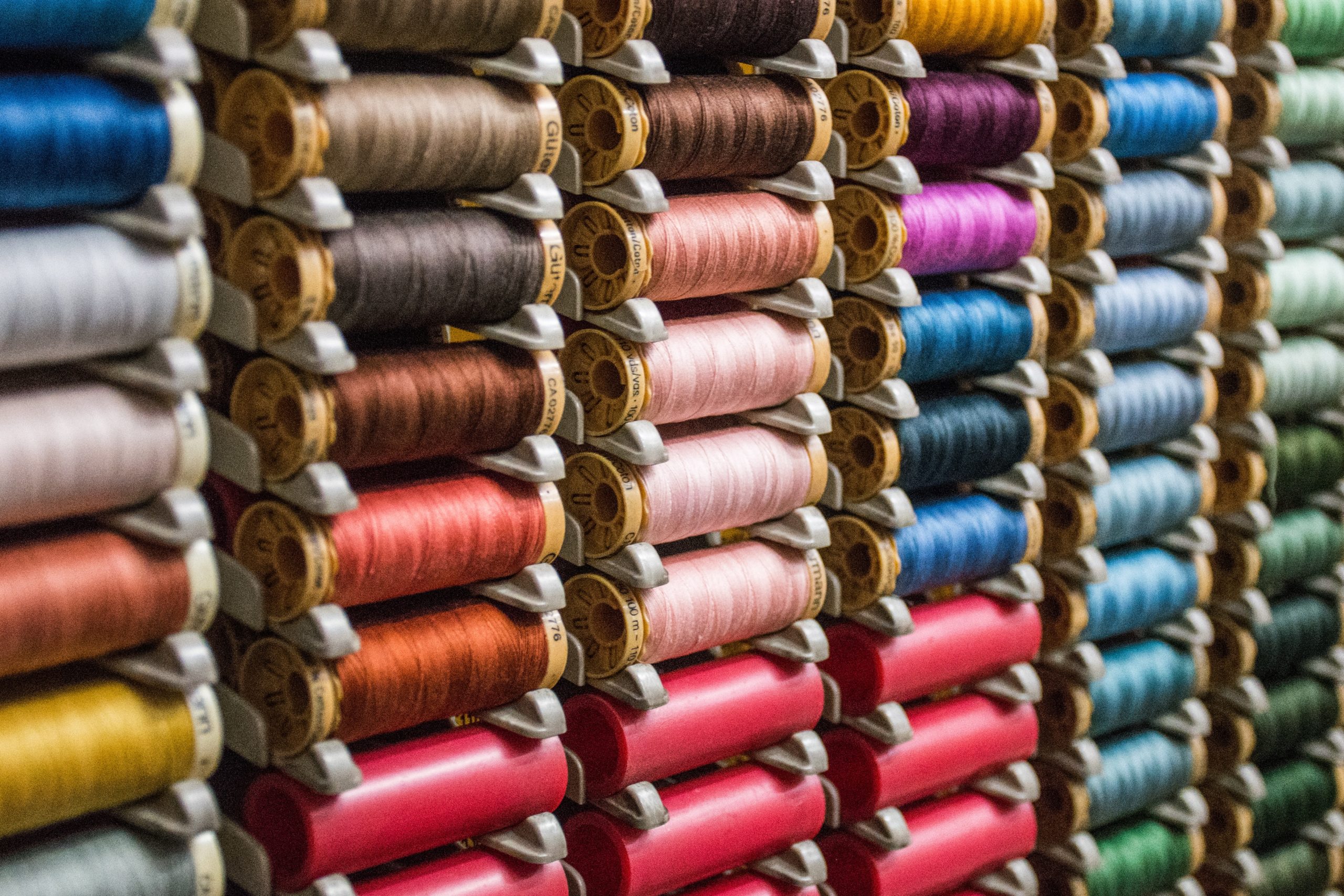 Array of colorful spools of thread