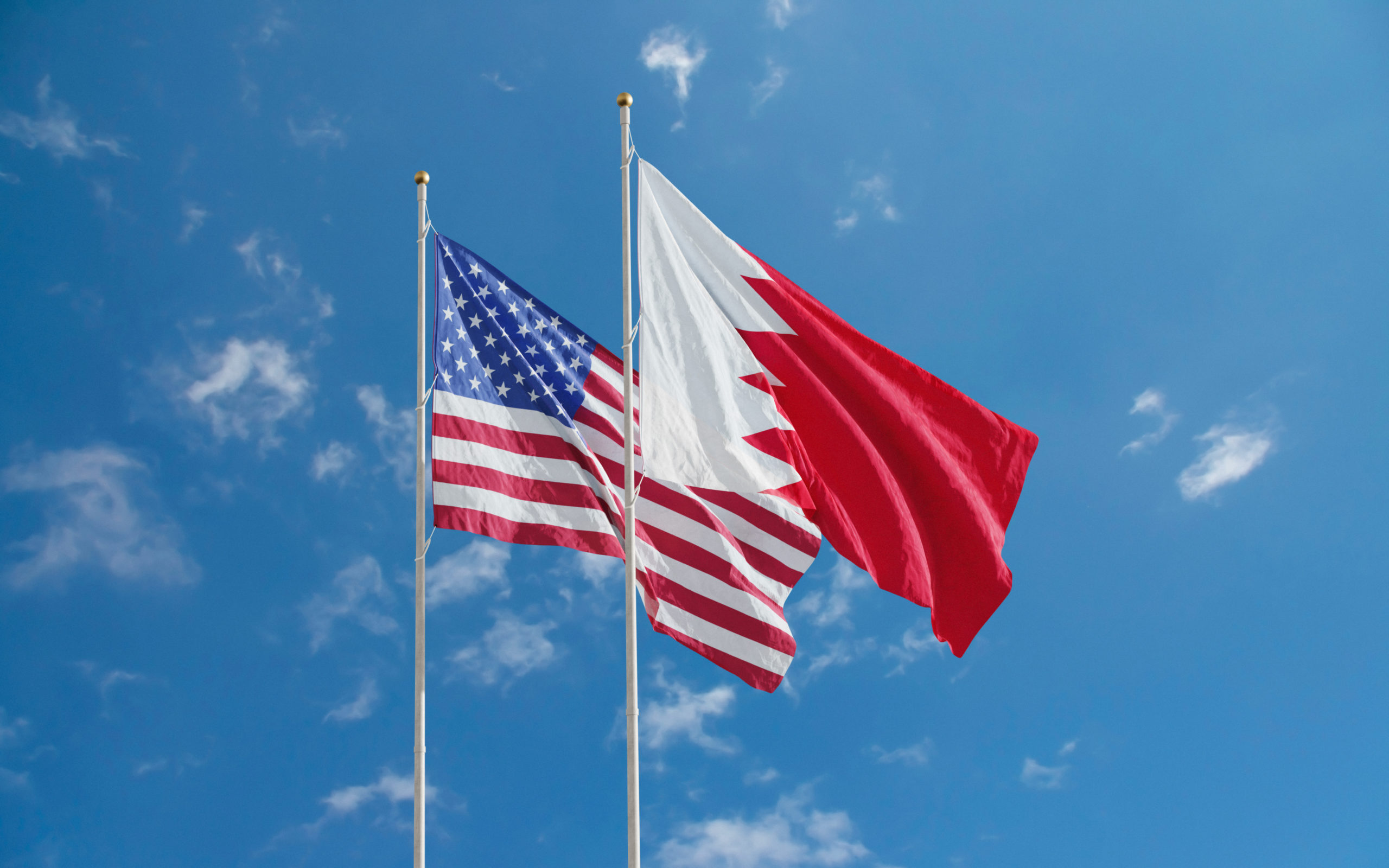 US Flag and Bahraini Flag Flying Next to Each Other
