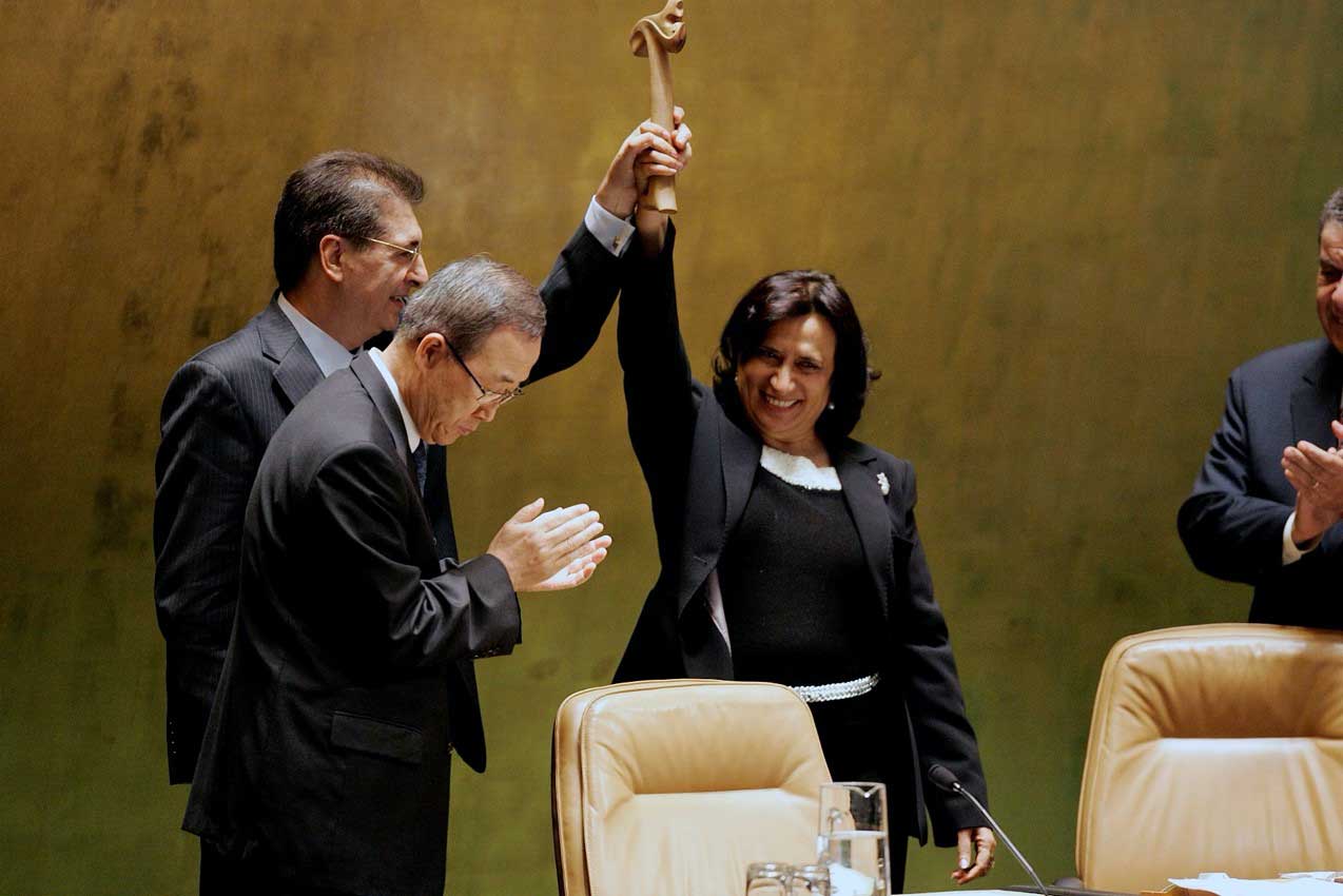 Haya Al Rashid, President of the 61st session of the United Nations General Assembly (right) hands the gavel to Sirjan Kerem (second right), President